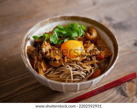 Curry Soba with egg yolk on top