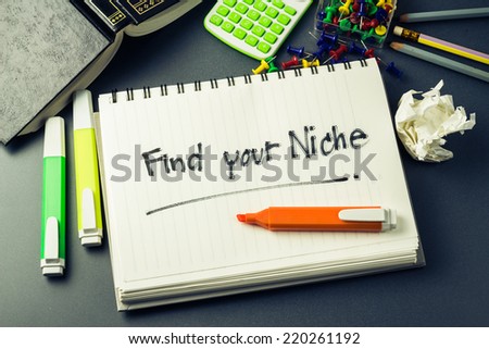 Handwriting of Find Your Niche word in notebook on the desk Royalty-Free Stock Photo #220261192