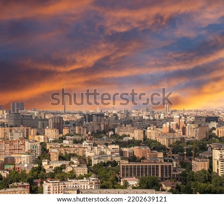 Aerial view of center of Moscow against the background of a romantic evening sky with clouds and rays of the sun, Russia  