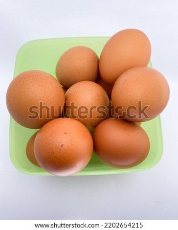 brown chicken egg on a white background