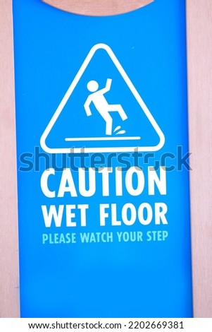 Caution wet floor or cleaning in progress. A yellow sign warning for the area was cleaned.