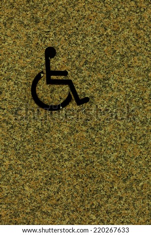 Handicapped sign on wall, detail of an information signal, disabled