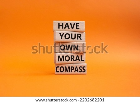 Have your own moral compass symbol. Business Concept words Have your own moral compass on wooden blocks. Beautiful orange background. Business and Have your own moral compass concept. Copy space Royalty-Free Stock Photo #2202682201