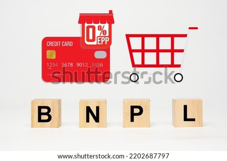 A picture of wooden block written BNPL, "Buy Now,Pay Later", credit card with 0% EPP sign and shopping cart icon.