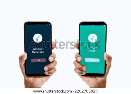 A man's hand holds a smartphone on screen with the message money sent and received. Concept of financial transactions with mobile devices. Closeup, money, transfer, phone, copy space. White background