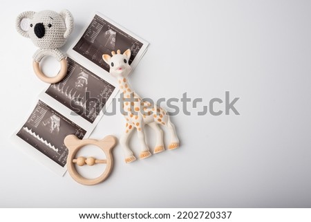 Baby toys with ultrasound picture pregnant concept Royalty-Free Stock Photo #2202720337