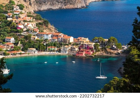 Close up top view at Asos village, Assos peninsula and fantastic blue Ionian Sea water. Aerial view, summer scenery of famous and extremely popular travel destination in Cephalonia, Greece, Europe Royalty-Free Stock Photo #2202732217