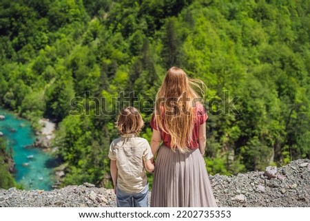 Mom and son tourists on the background River bend, Montenegro,.natural landscape, mountain river Tara Portrait of a disgruntled girl sitting at a cafe table