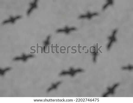 Halloween design. Halloween blurry pattern with bats on a gray background 3d-rendering.