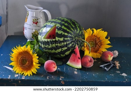 still life with watermelon, flowers and fruit