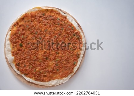 Turkish foods, traditional Turkish pizza, called lahmacun. top view of  delicious lahmacun isolated on white background. homemade natural turkish food, selective focus Royalty-Free Stock Photo #2202784051
