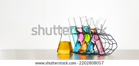 Banner and copy space of flask with lab glassware and test tubes in chemical laboratory background, science laboratory research and development concept.