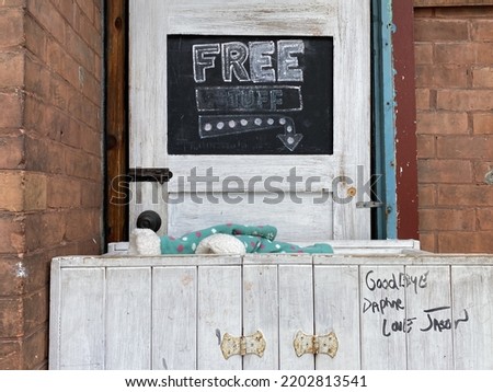 Free stuff signage outside a business storefront on Preston street in Ottawa Ontario Canada.