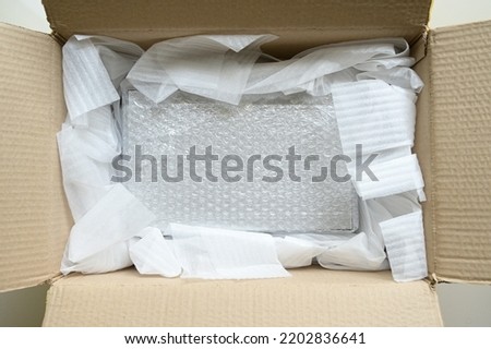 white wrap bubble put in brown box