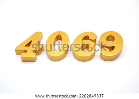  Number 4069 is made of gold-painted teak, 1 centimeter thick, placed on a white background to visualize it in 3D.                                