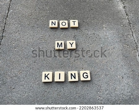 Concept image of tiles spelling not my king referring to the current anti monarchy movement