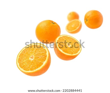 Orange with cut in half levitate isolated on white background. Royalty-Free Stock Photo #2202884441
