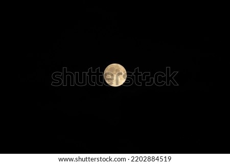 Bright full Moon in the dark sky. Night Sky photography.