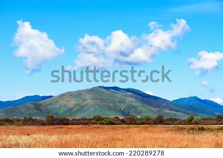 Landscape with mountain views, blue sky and beautiful clouds. Real scene without any light effects.