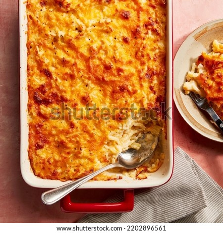 Cheesy Hash Brown Casserole with spoon
 Royalty-Free Stock Photo #2202896561
