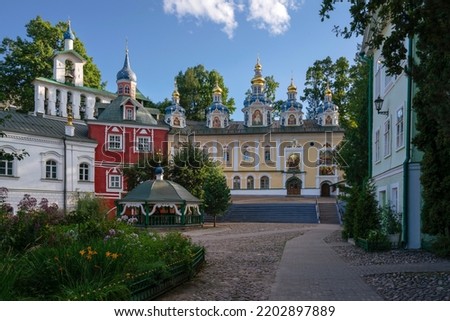 View of the Assumption Cathedral, the Great Belfry and the sacristy in the Holy Dormition Pskov-Pechersk Monastery on a sunny summer day, Pechory, Pskov region, Russia Royalty-Free Stock Photo #2202897889