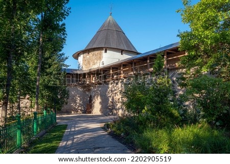 View of the Tailovskaya Tower of the Holy Dormition Pskov-Pechersk Monastery on a sunny summer day, Pechory, Pskov region, Russia Royalty-Free Stock Photo #2202905519