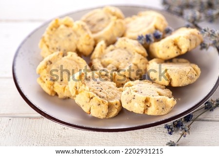keto cookies on a white wooden background, decorated with lavender, close-up Royalty-Free Stock Photo #2202931215
