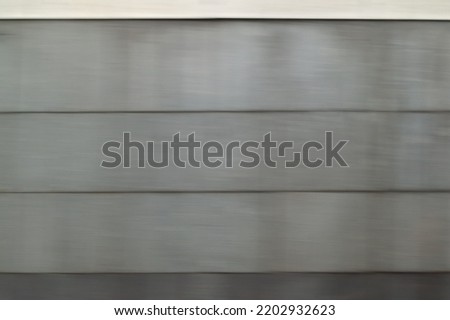 abstract background with a gray wall. motion blur. defocused
