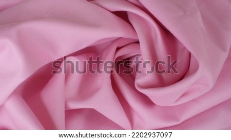 Beautiful soft pink color fabric texture seamless with beautiful closeup detail fabric. Unique cotton fabric pattern texture for crafting and sewing projects.