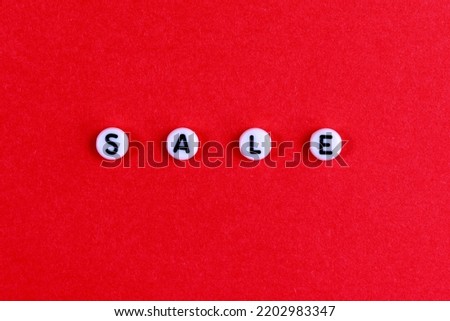 .The inscription SALE on a red paper background. Advertising, postcard, banner. Good quality