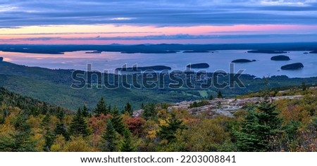 Sunset Bar Harbor - A panoramic overview of Bar Harbor and its islands at Frenchman Bay on a colorful Autumn evening, as seen from Cadillac Mountain of Acadia National Park. Maine, USA. Royalty-Free Stock Photo #2203008841