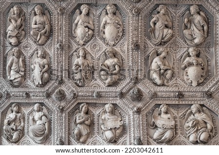 Detail of the religious stone sculptures on the portal of Dijon cathedral