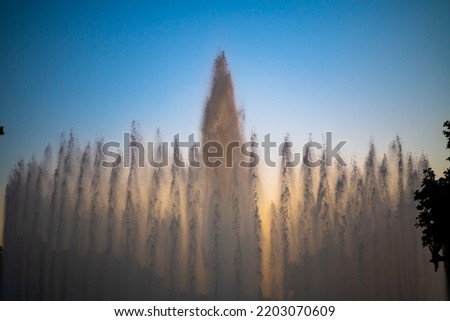 Day Photograph Before Sunset Of The Performance Of The Singing Magic Fountain Of Montjuic In Barcelona, Catalonia, Spain.