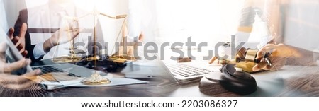 Judge gavel with Justice lawyers having team meeting at law firm in background. Concepts of law. Royalty-Free Stock Photo #2203086327