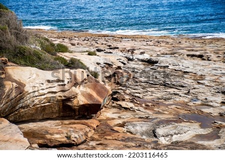 Beautiful ocean and rocky sandstone coastline view. Travel destination. Royal National Park, NSW, Australia. Jibbon Loop Track.