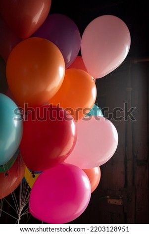 Group of colored balloons floating on air