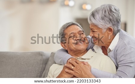 Relax, retirement and senior Mexico couple on sofa at home enjoying free time with smile, hug and love. Happy, comfortable and relationship of elderly man and woman on couch in living room together Royalty-Free Stock Photo #2203133343