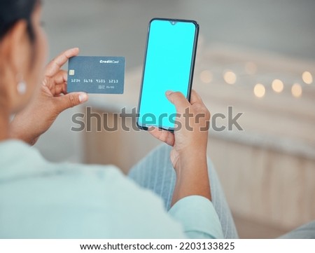 Ecommerce, credit card and woman with green screen phone mockup in hand for a payment, online shopping and banking. Female using fintech app and paying on internet with website app on 5g smartphone