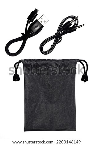 usb cable​ with​ Black drawstring bag packaging isolated​ on​ white​ background.
