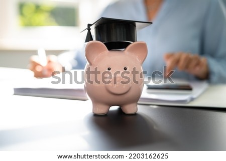 Student Loan. Accounting Teaching Advisor And Graduate Cap Royalty-Free Stock Photo #2203162625