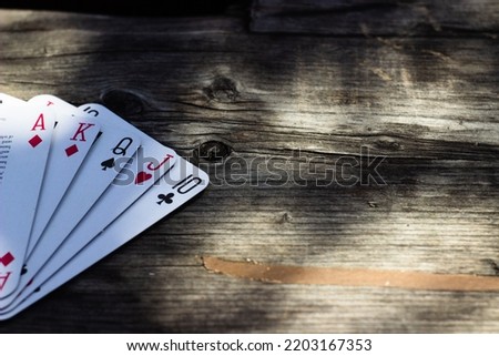 poker cards on wooden surface