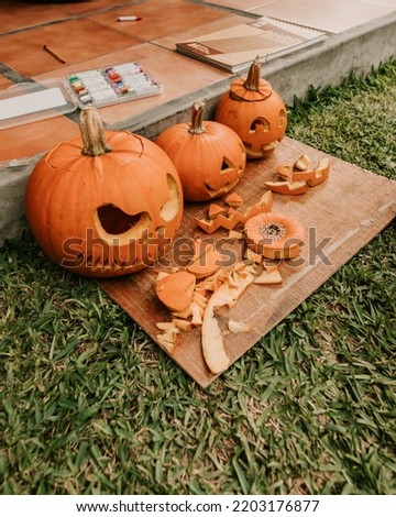 Three carved Jack o lantern pumpkins