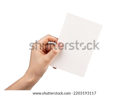 Hand holding postcard mockup isolated on white background. Letter, invitation, brochure, greeting template with place for text. Paper in rotated position. High quality photo Royalty-Free Stock Photo #2203193117