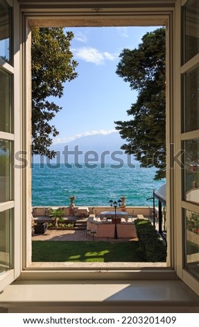 Window view to Lake Como in Italy Royalty-Free Stock Photo #2203201409
