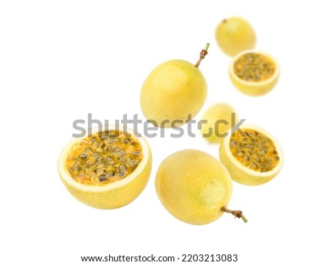Yellow passion fruit (Passiflora edulis) levitate isolated on white background.
  Royalty-Free Stock Photo #2203213083