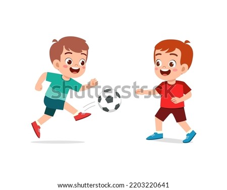 little kid play football together with friend Royalty-Free Stock Photo #2203220641