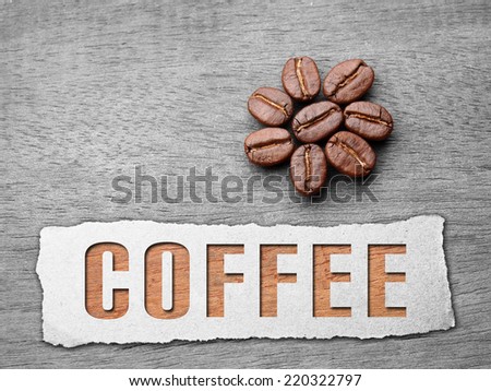 Coffee crop beans with paper and text on wood texture background Royalty-Free Stock Photo #220322797