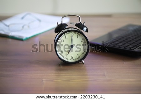 Alarm clock on the table. Time concept. Being late for work school.