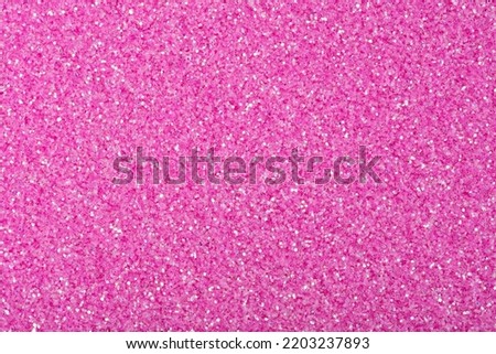 Glitter background in excellent pink colour as part of your unique Christmas design. Holiday abstract glitter background with blinking lights. Fabric sequins in bright colors. Fashion glitter, sequins