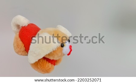 Stuffed dogs in yellow and white colors for children's toys, stuffed toys on a gray background